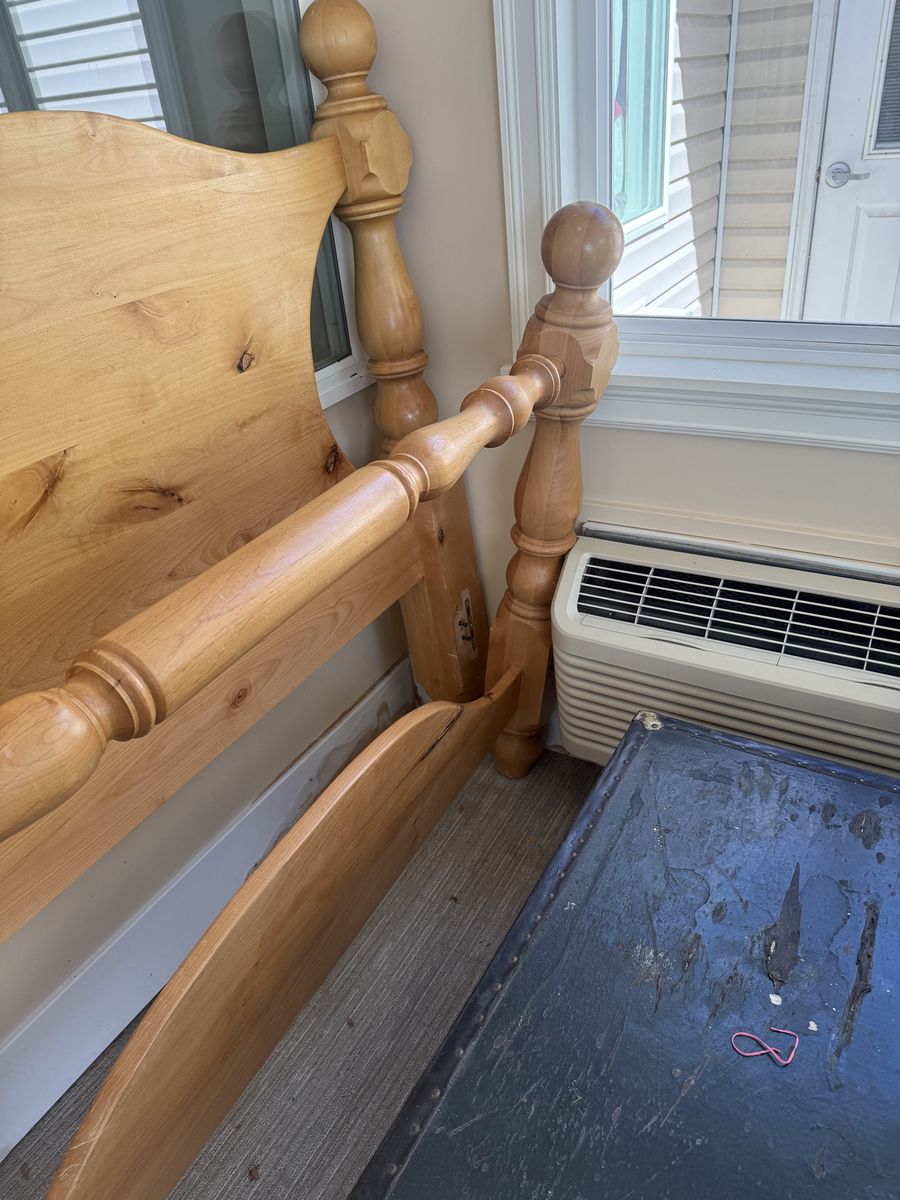 Queen bed and wooden rails