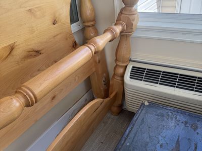 Queen bed and wooden rails