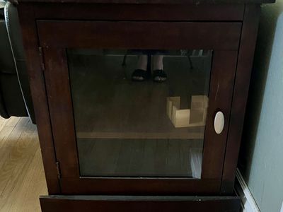 Table with storage glass door