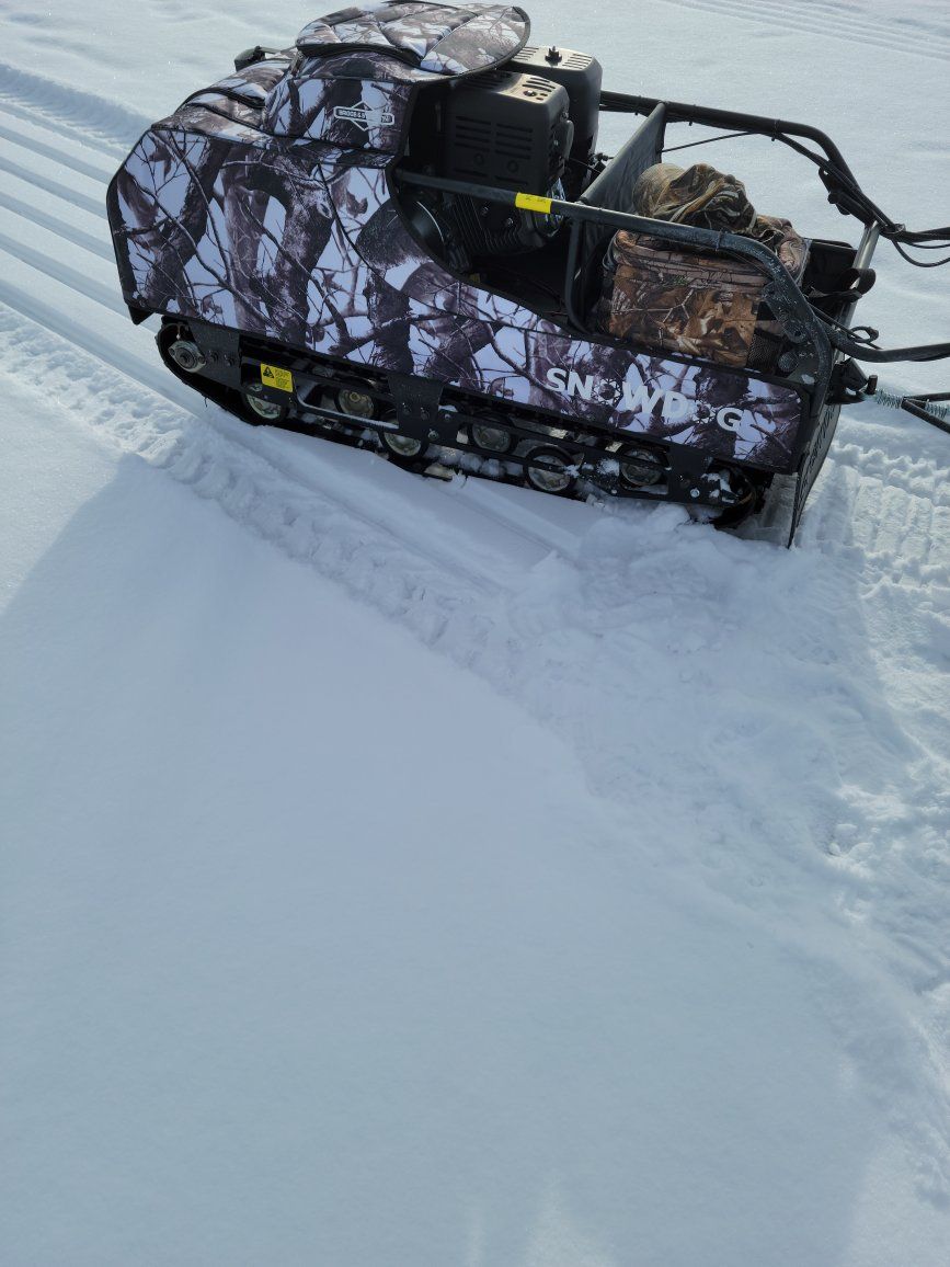 SnowDog Sport Track Machine with Camo Wrap and Tow Sled