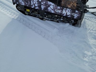 SnowDog Sport Track Machine with Camo Wrap and Tow Sled