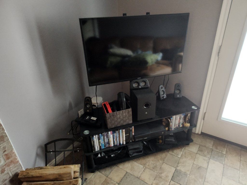 Entertainment center with 40-in TV and speakers