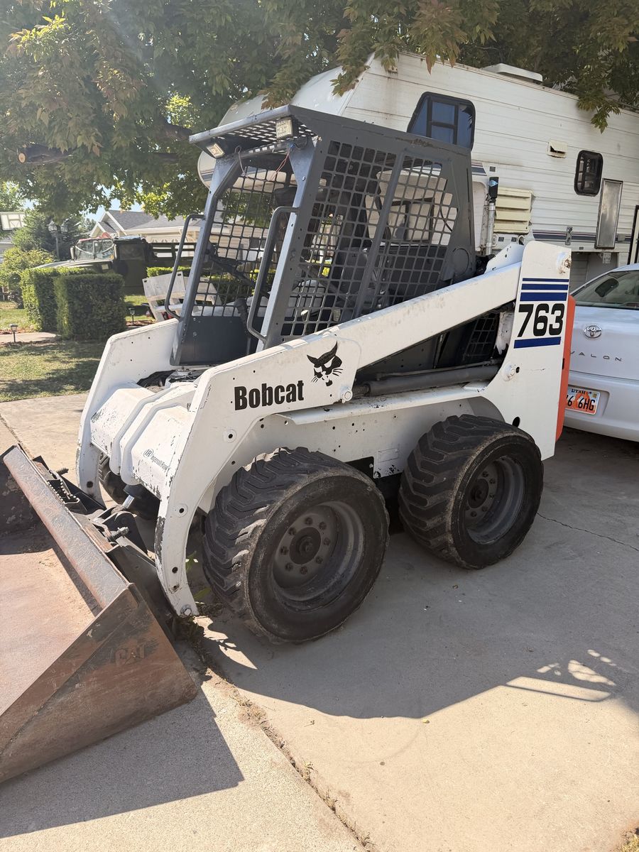 Bobcat 763 Skid Steer Loader - White/Orange, Diesel Engine, Heavy Equipment