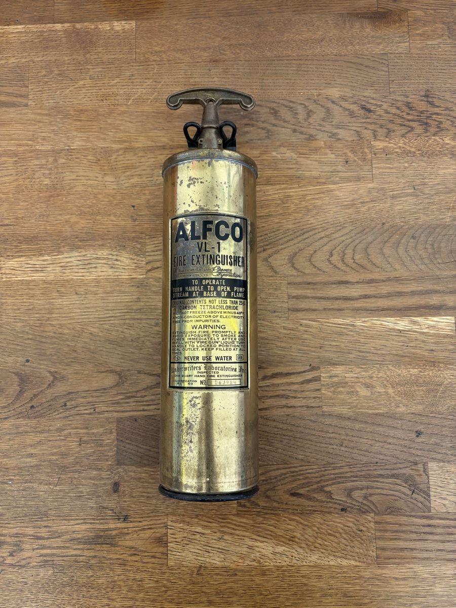 Antique brass fire extinguisher