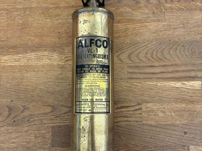 Antique brass fire extinguisher