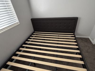 King - sized bed frame and headboard