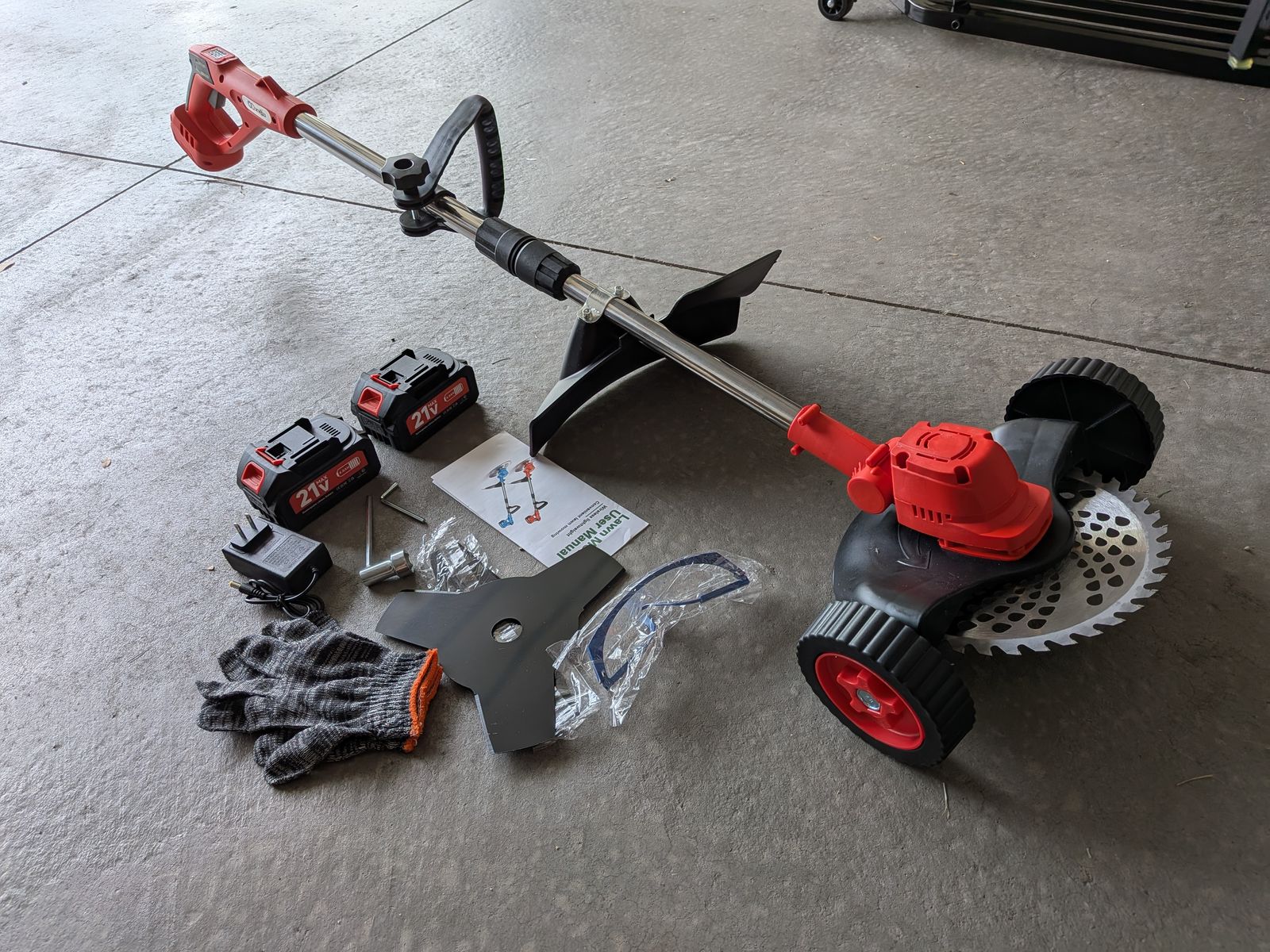 21V Electric Weed Cutter with wheels, 9" primary blade, includes 2 other blade types - never been used!