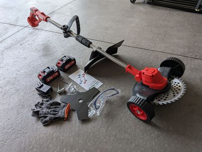 21V Electric Weed Cutter with wheels, 9" primary blade, includes 2 other blade types - never been used!