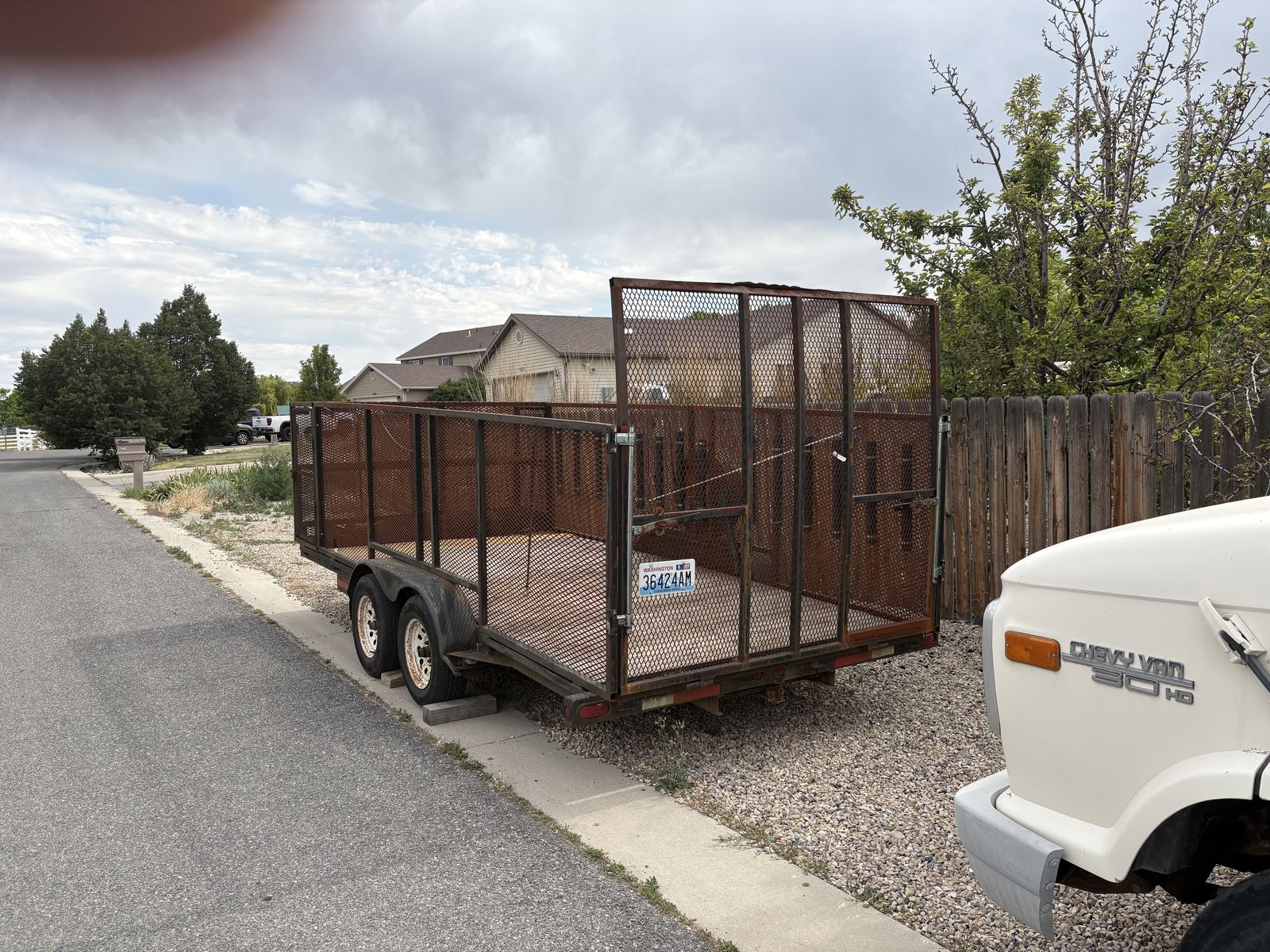 Utility Trailer with High Mesh Sides and Ramp Gate - Great for Hauling!