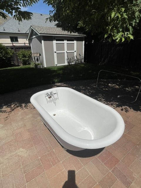 4'8" Vintage Cast Iron Chrome Claw tub with faucet, shower/curtain rod and drain hardware