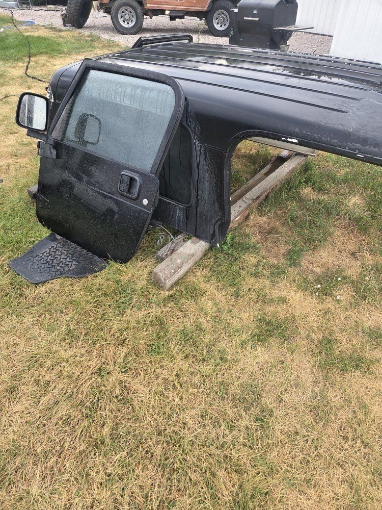 l j hard  top and a set
factory  doors. top