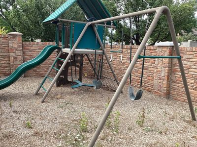 Lifetime Sturdy Children's Outdoor Playset with Slide, Swings, and Climbing Features