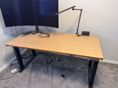 UPLIFT V2 Standing Desk (60" x 30") – Bamboo Top – Electric Sit/Stand + Light + Power Outlet