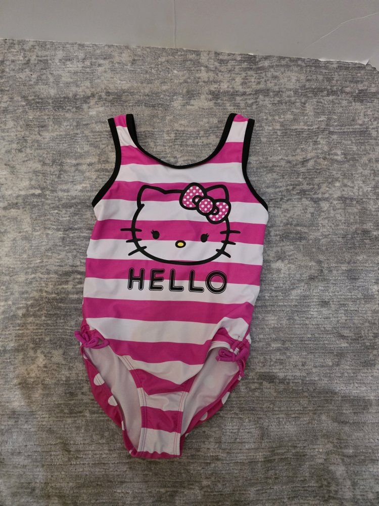 Girls Hello Kitty Pink Striped and Polka Dot One-Piece Swimsuit 
Size 7-8

Smoke Free Home
