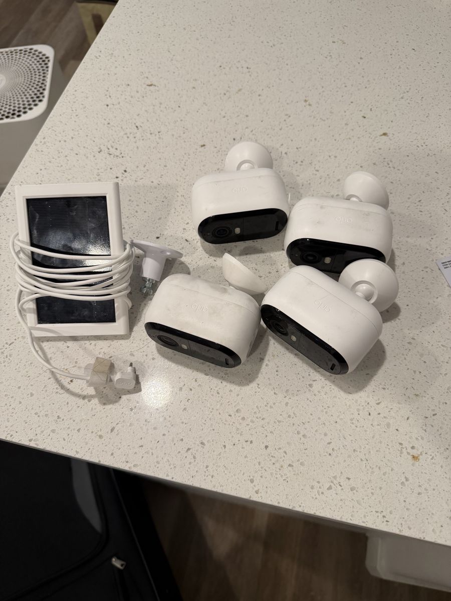Arlo cameras solar power charger and 4 cameras