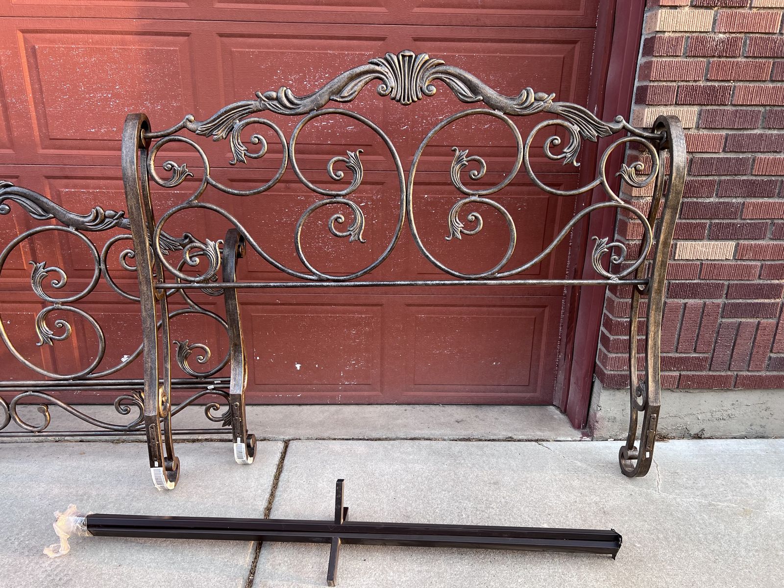 Antique finish, solid metal sleigh-style queen-size headboard, footboard, and frame.