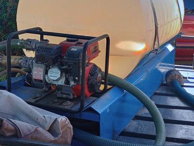 250 gallon water tank and pump on skid