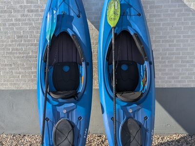 4 sit-inside LIFETIME kayaks with paddles and life jackets