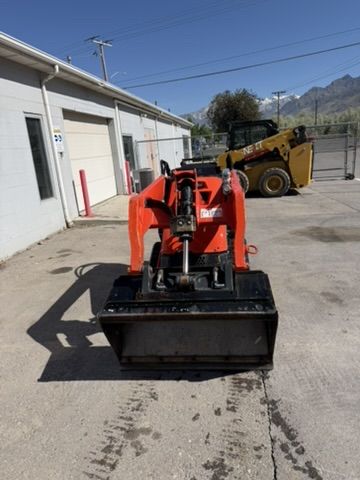Kubota SCL1000 Mini Track Skid for Rent. Stand on Skid for Backyards
