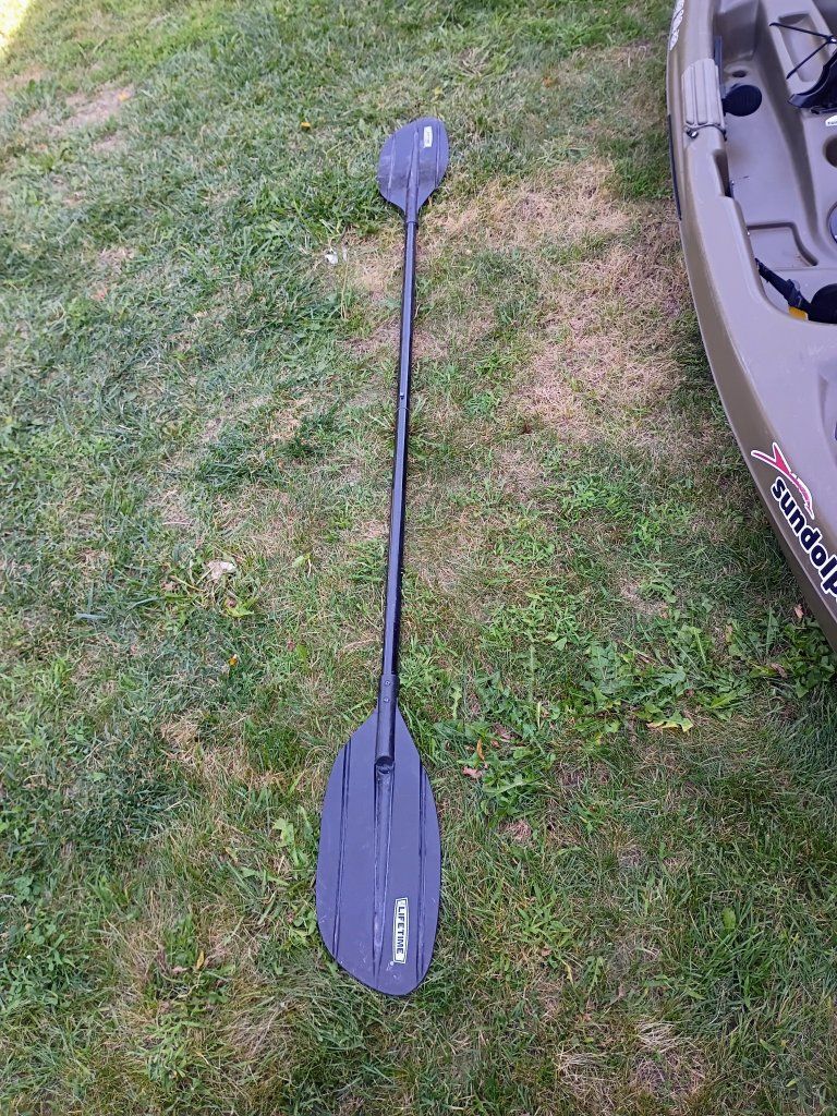Fisherman ready Sun Dolphin Journey 10 SS Sit-On-Top Kayak with Paddle and pole holders
