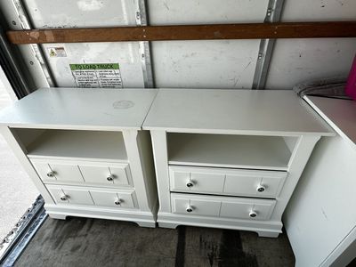 two large white wood nightstands. *one of them has paint defect on top surface*