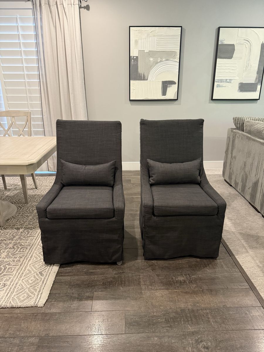 2 Dark Gray Upholstered Dining Host Chairs with Accent Pillows