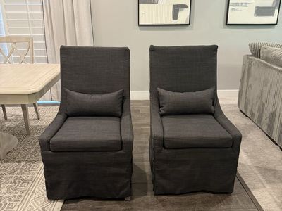 2 Dark Gray Upholstered Dining Host Chairs with Accent Pillows
