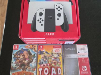 Nintendo Switch OLED Model with Donkey Kong Country, Captain Toad, and Crisis Core Final Fantasy VII