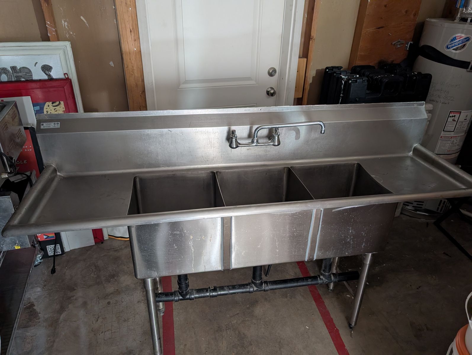 Commercial 3-compartment stainless steel sink (restaurant-grade). Atlanta Culinary Equipment Inc.