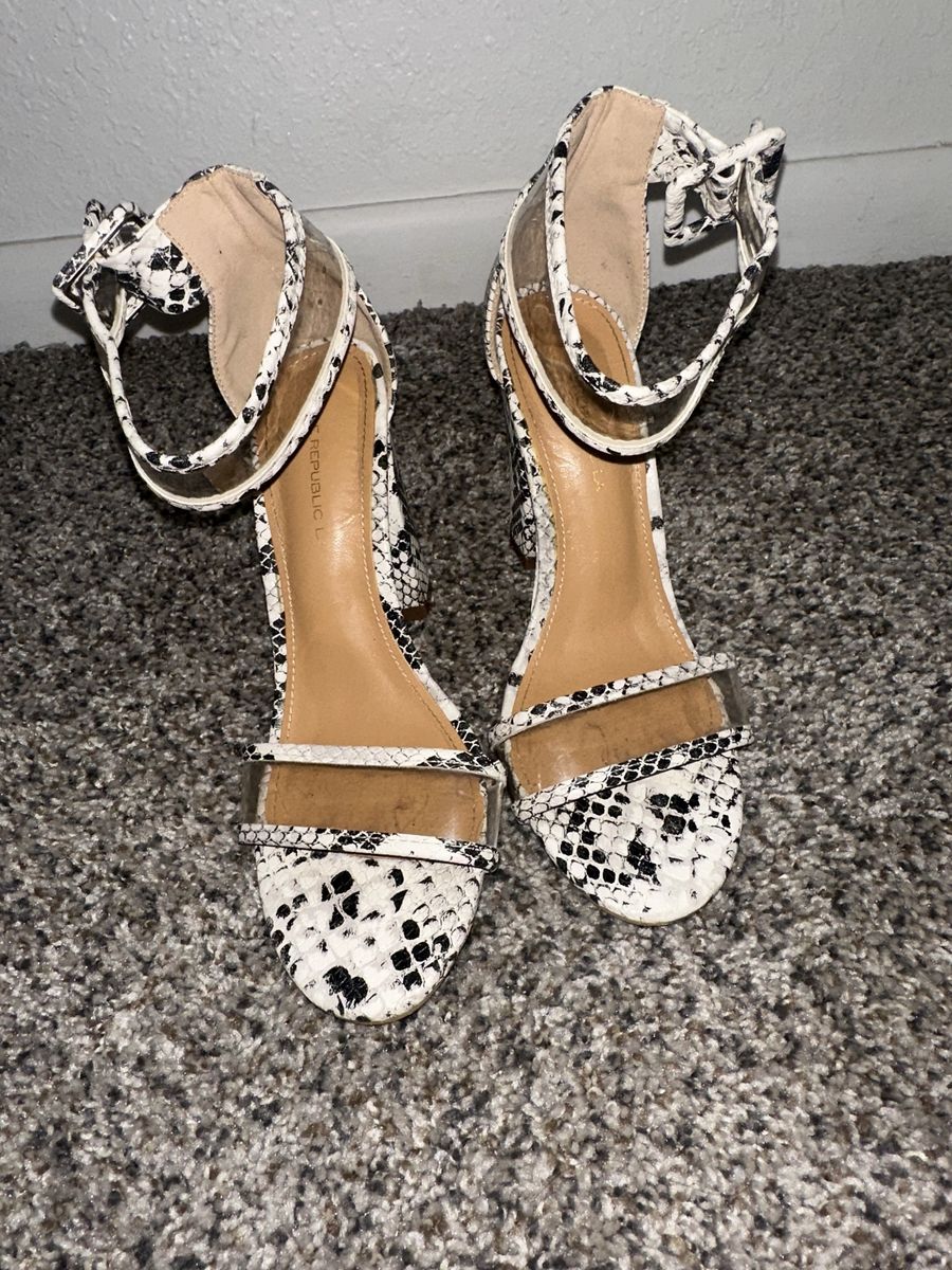 White high heels with snake print