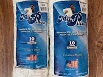 Two new queen premium MyPillows medium firmness - never out of bag.