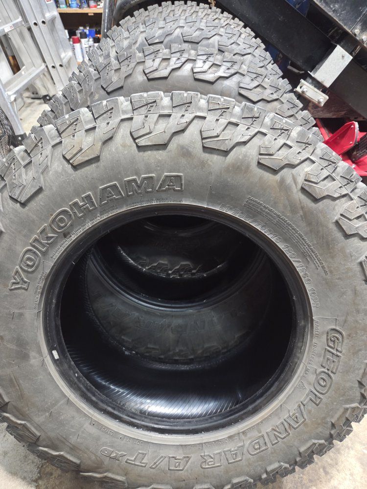 Set of Yokohama Geolander AT X/D 10 ply tires. 295/70r18