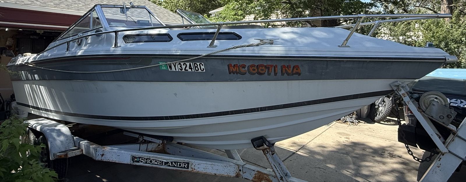 1986 Celebrity cuddy cabin with Shoreland'r Trailer.