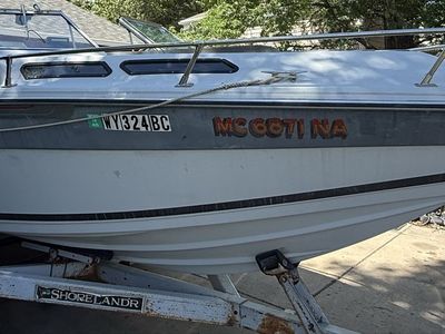 1986 Celebrity cuddy cabin with Shoreland'r Trailer.