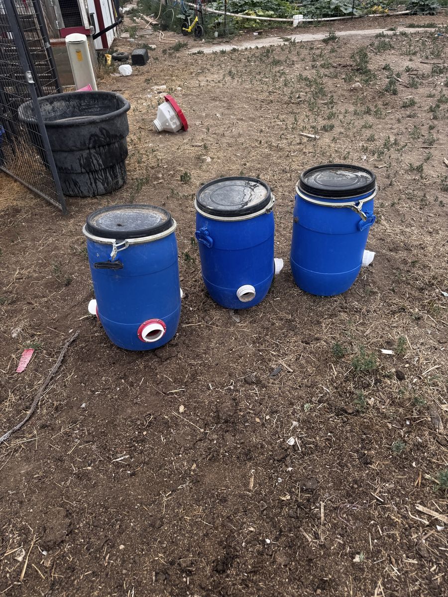 3 15-Gallon Blue Plastic Barrels with Feed Ports - Livestock Feeders