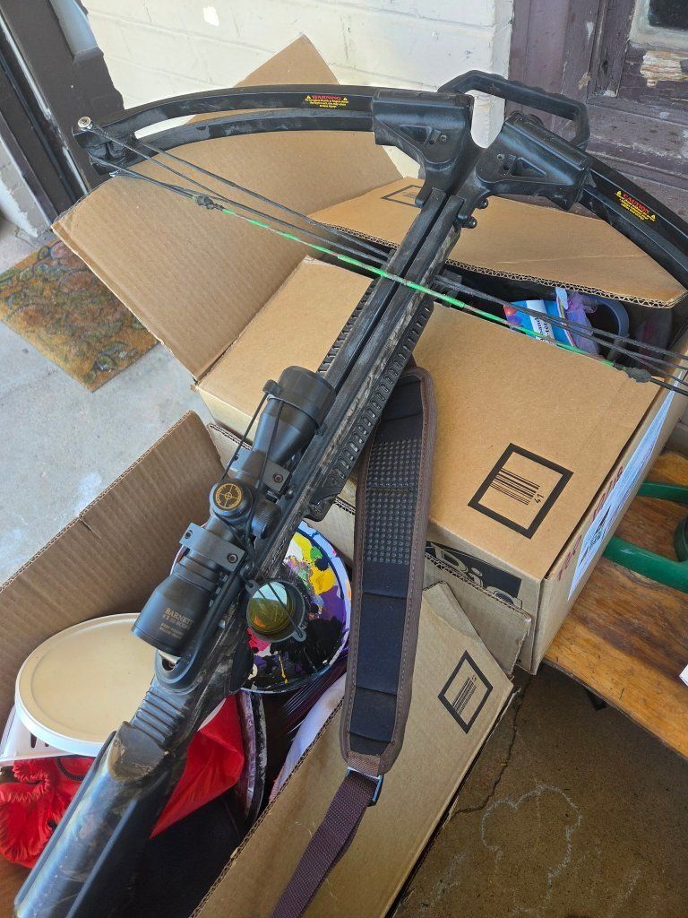 cross bow / comes with scope, and cocking rope.