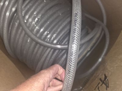 Brand new 3/4" ID reinforced braided PVC hose – bulk coil, never used.