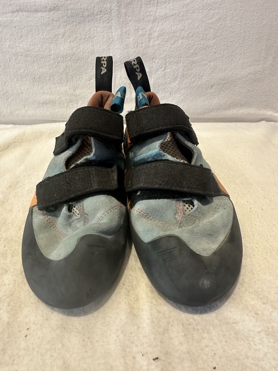 Scarpa force V men’s 8 women’s  9 blue/black/orange climbing shoes with two Velcro straps.