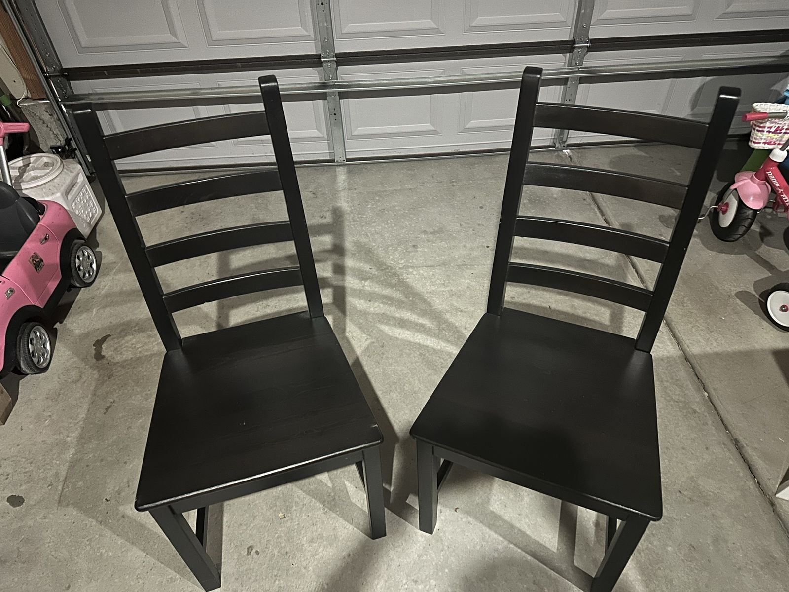 Two black IKEA Kaustby Chairs