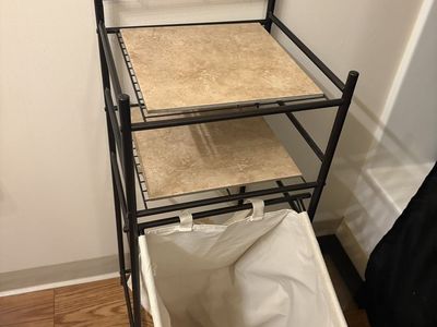 Black Metal Bathroom Space Saver Storage Rack with Tilt-Out Laundry Hamper and Shelves