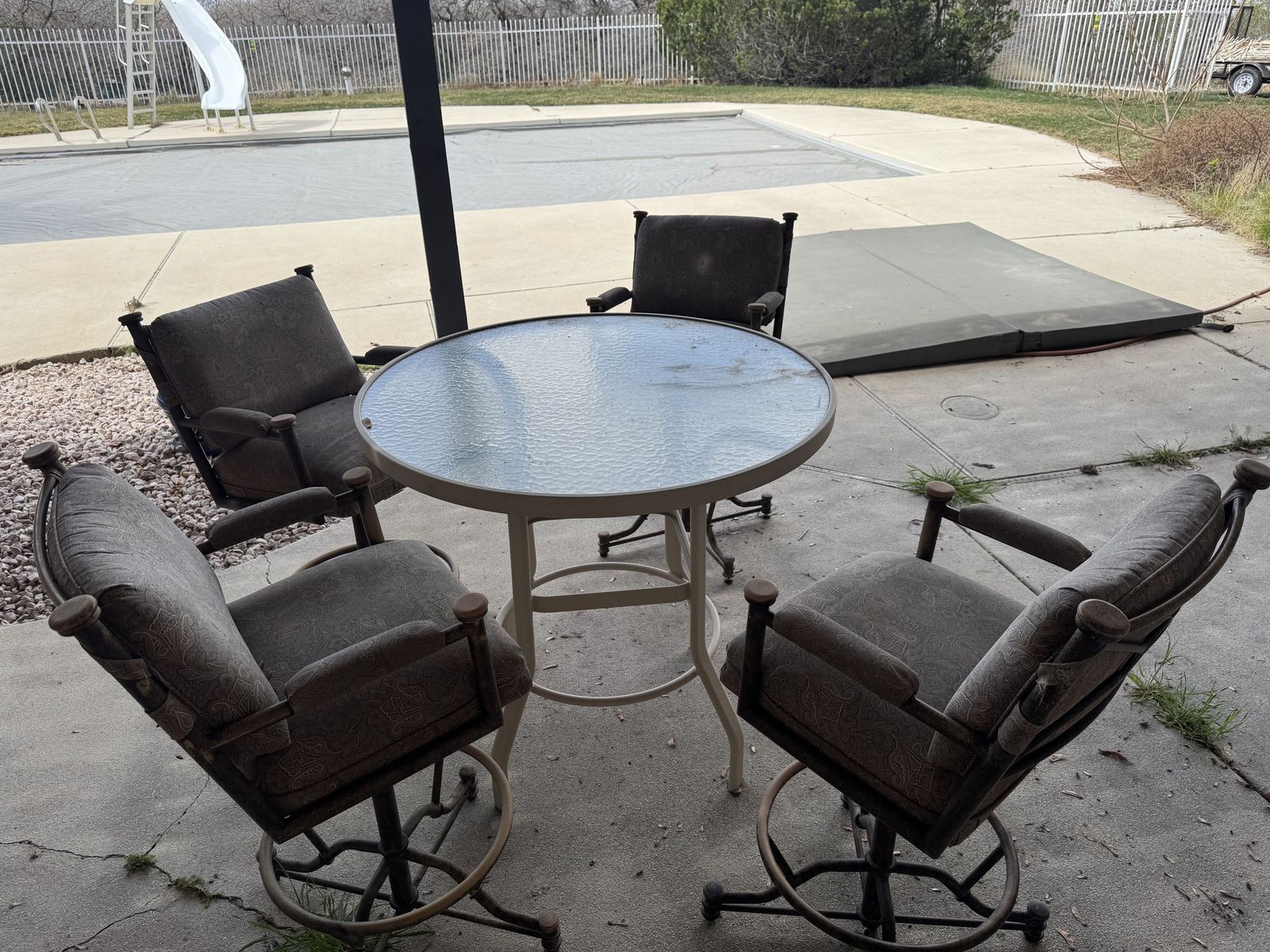 High Top Glass Table And Swivel Chairs