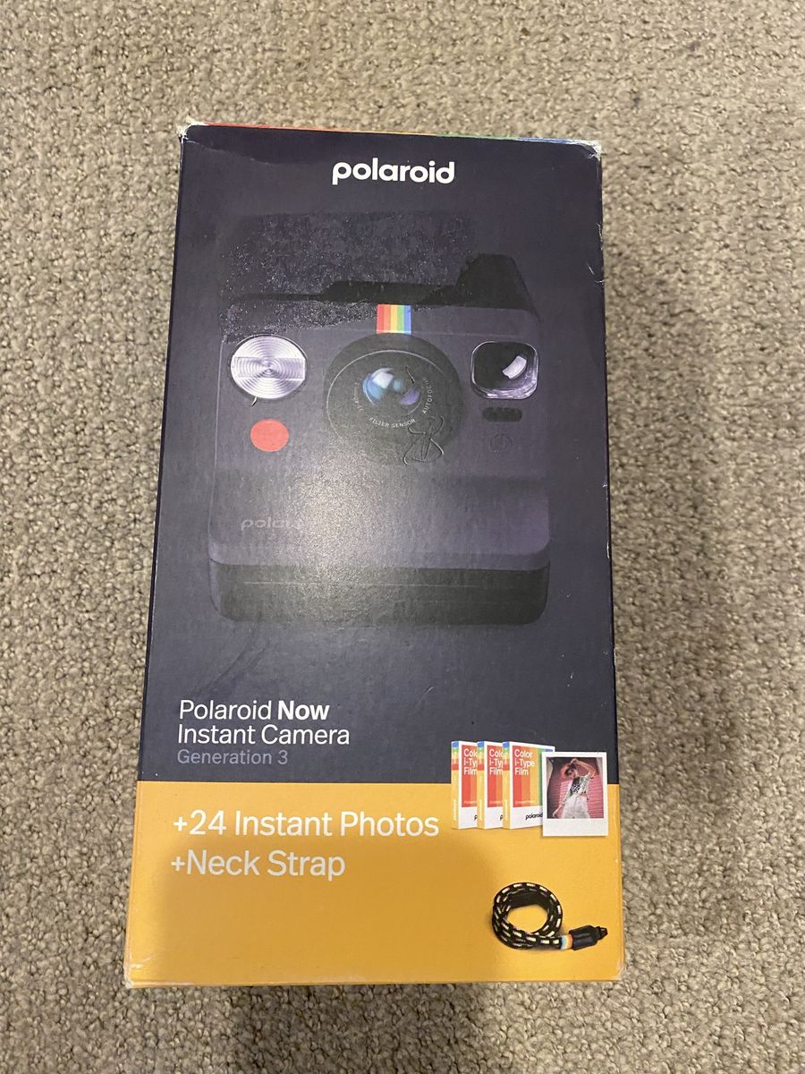 New Polaroid camera with film