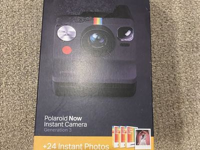 New Polaroid camera with film