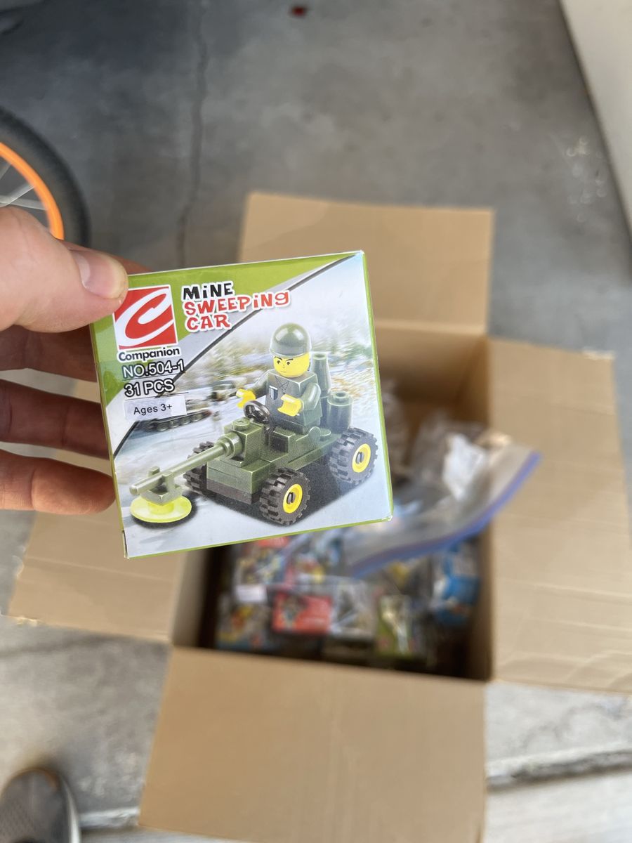 25 assorted minifig vehicle kits.