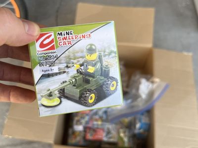 25 assorted minifig vehicle kits.