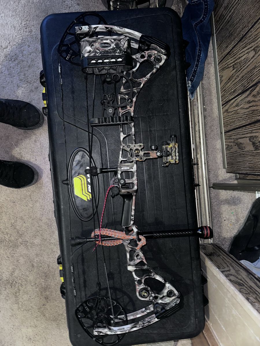 Mathews Compound Bow in Camo with Quiver, Sight, and Stabilizer