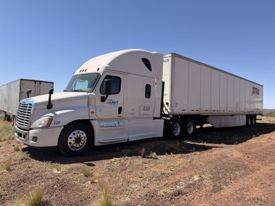 2016 Freightliner Cascadia 125 Semi Truck and Van Trailer