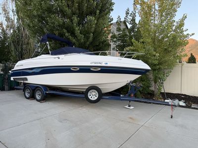 1998 Four Winns 245 sundowner cuddy with open seating