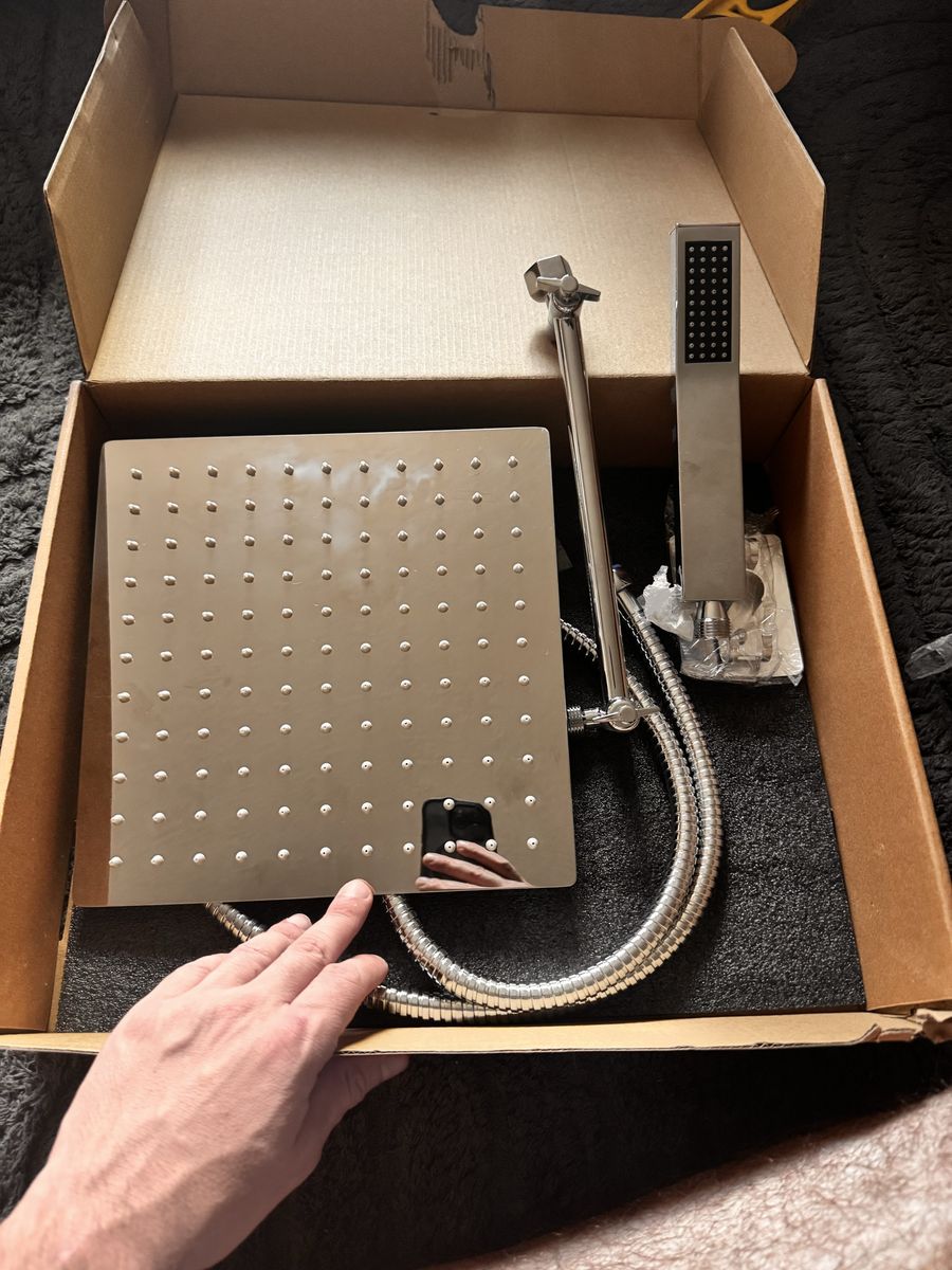 Brand new soaking shower head set.