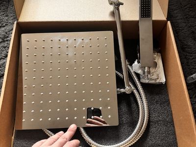 Brand new soaking shower head set.